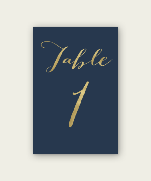 A navy and gold table number