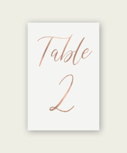 A modern rose gold foil table number