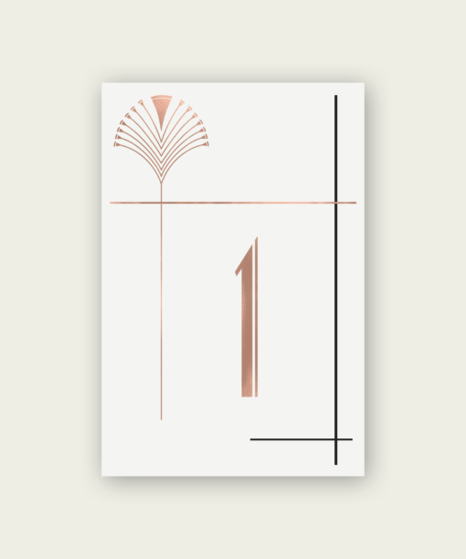 A rose gold and black art deco table number